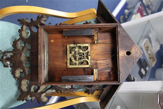 A Black Forest carved cuckoo clock 35in.